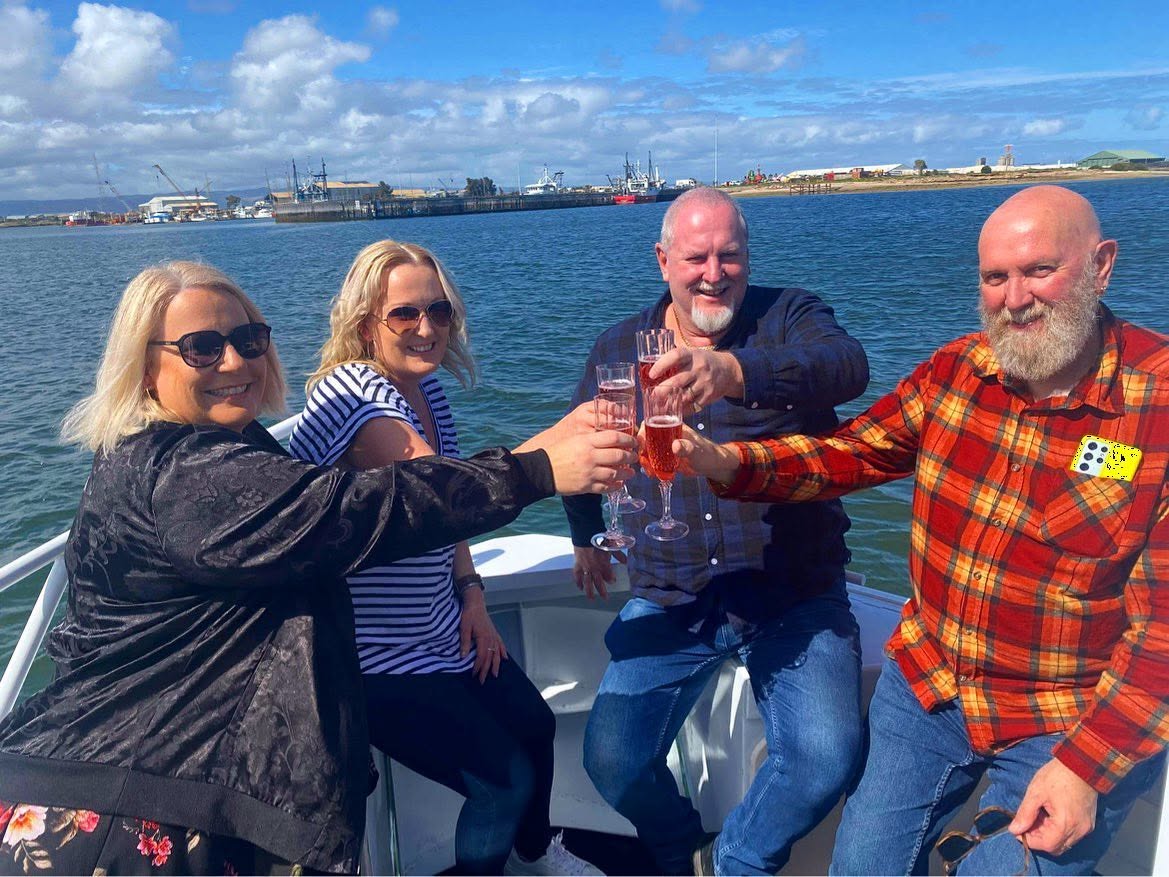 Friends celebrating together on a private Port River cruise